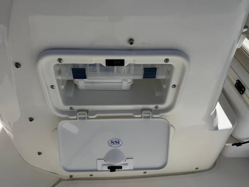 Slide: The Image of 2022 Boston Whaler 170 Montauk boat storage compartment with SSI logo. - 13