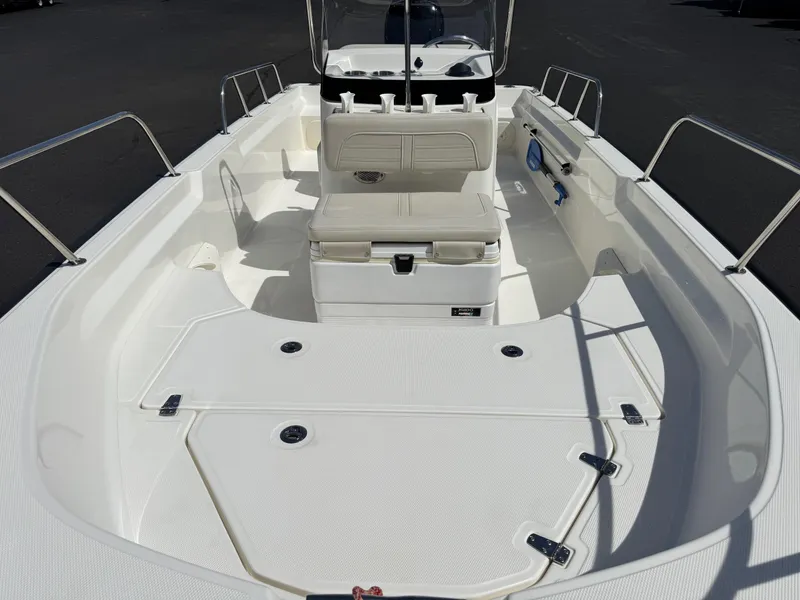 Slide: The Image of 2022 Boston Whaler 170 Montauk boat interior with seating and storage compartments. - 5