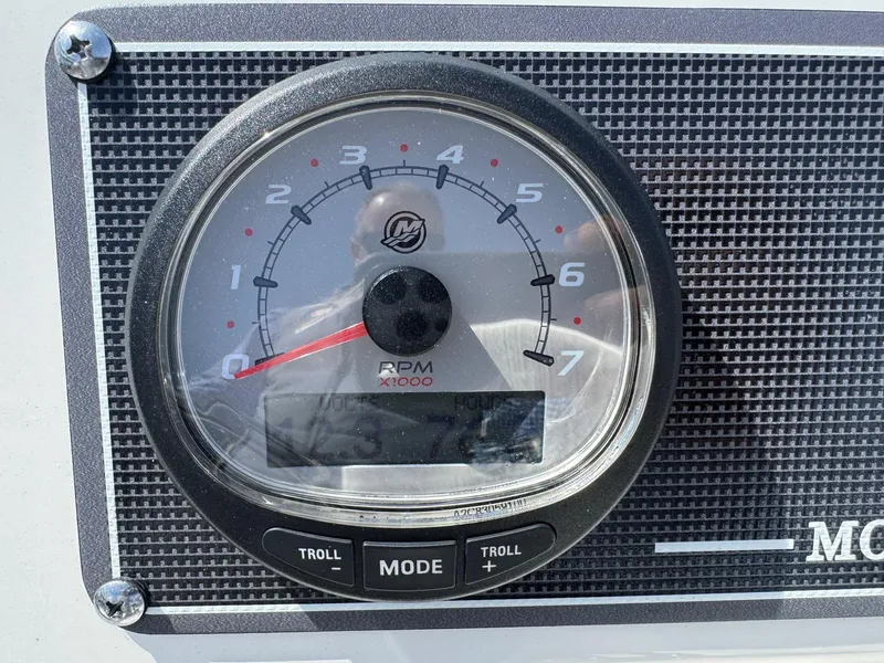 Slide: The Image of Tachometer of 2022 Boston Whaler 170 Montauk boat, displaying RPM and control buttons. - 9
