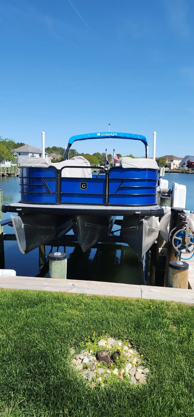 Slide: The Image of 2023 Godfrey SWEETWATER 2286 SB pontoon boat docked by a lake. - 3