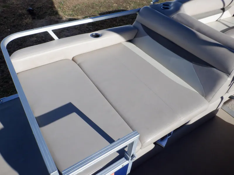 Slide: The Image of 2014 Sun Tracker Party Barge 24 DLX pontoon boat seating area with beige upholstery. - 10