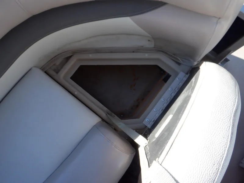 Slide: The Image of Open storage compartment on 2014 Sun Tracker Party Barge 24 DLX boat seat. - 13
