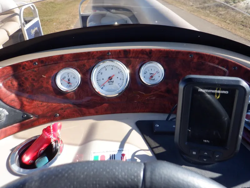 Slide: The Image of Dashboard of 2014 Sun Tracker Party Barge 24 DLX with gauges and navigation system. - 22