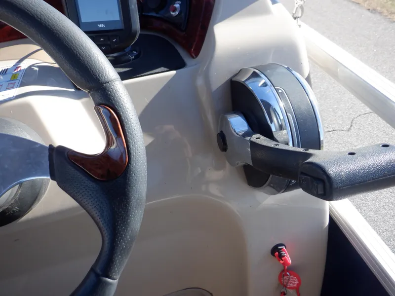Slide: The Image of Steering wheel and throttle of 2014 Sun Tracker Party Barge 24 DLX pontoon boat. - 24