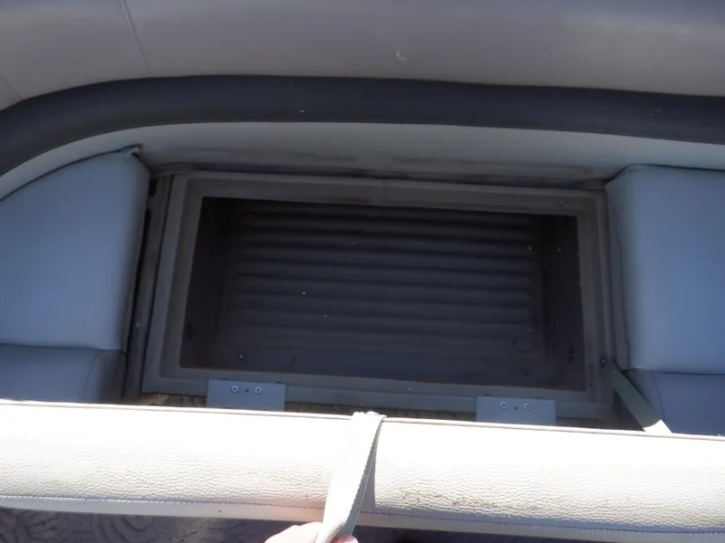 Slide: The Image of 2014 Sun Tracker Party Barge 24 DLX storage compartment with cushioned seating. - 28