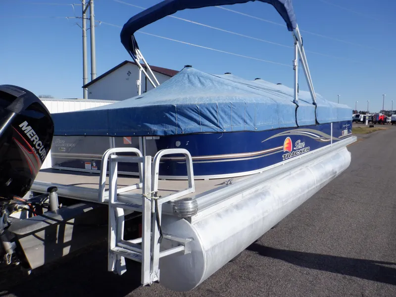 Slide: The Image of 2014 Sun Tracker Party Barge 24 DLX pontoon boat with blue cover and Mercury outboard. - 38