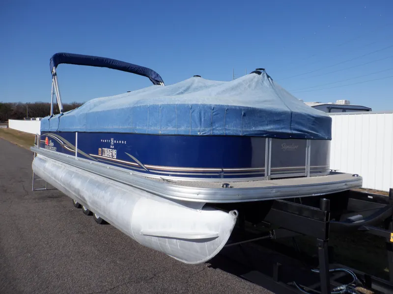 Slide: The Image of 2014 Sun Tracker Party Barge 24 DLX pontoon boat with cover on trailer. - 39