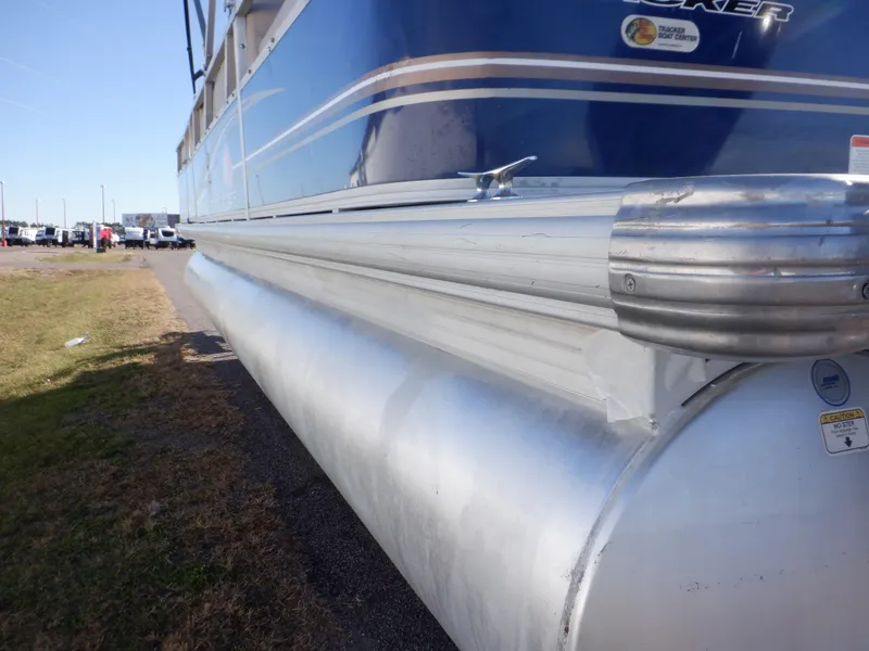 Slide: The Image of 2014 Sun Tracker Party Barge 24 DLX pontoon boat, side view, blue and silver design. - 7