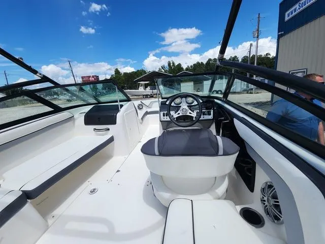 Slide: The Image of 2015 Yamaha Boats AR192 interior with steering wheel, seating, and clear blue sky. - 10