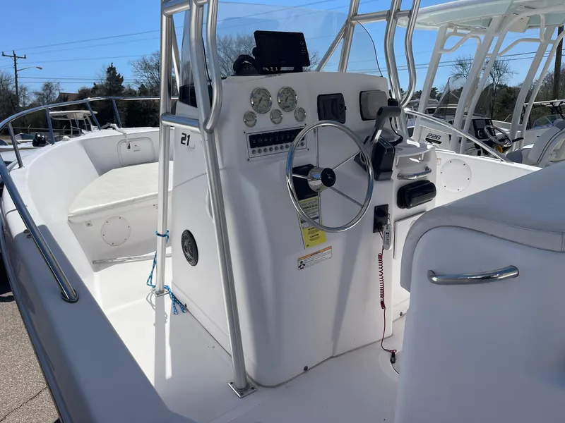 Slide: The Image of 2007 Pro-Line 21 Sport boat interior with steering console and seating area. - 11