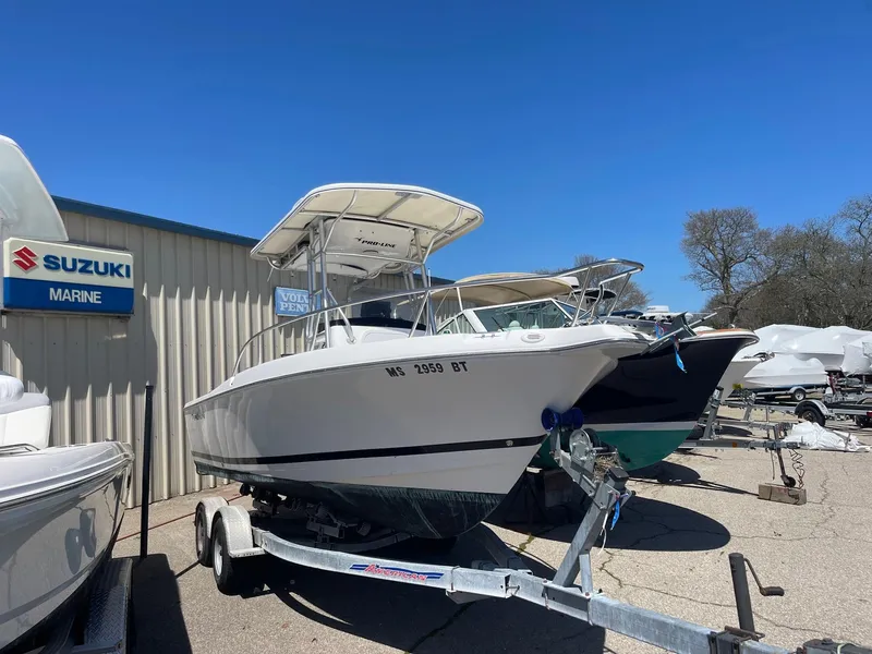 Slide: The Image of 2007 Pro-Line 21 Sport boat on trailer at Suzuki Marine dealership. - 2