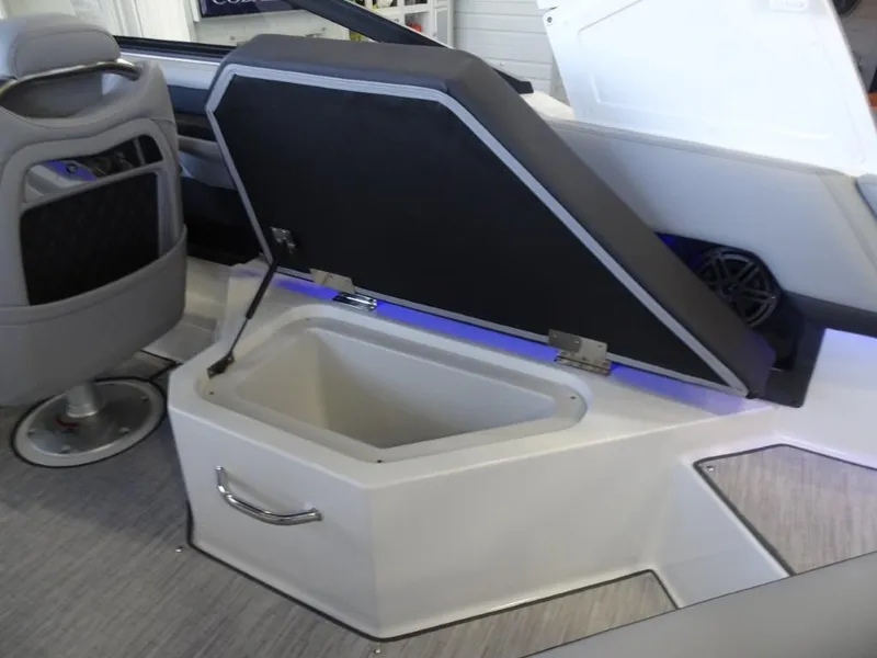 Slide: The Image of 2025 Cobalt R4 boat interior with open storage compartment and seating. - 11