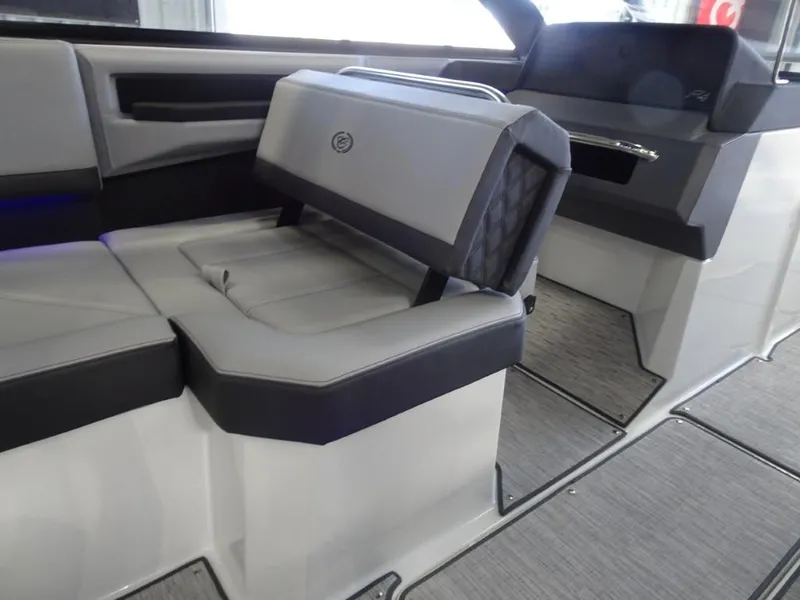 Slide: The Image of 2025 Cobalt R4 boat interior with gray seating and modern design. - 14