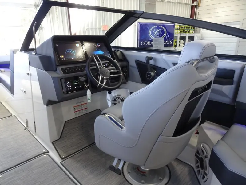 Slide: The Image of 2025 Cobalt R4 boat interior with modern dashboard and steering wheel in a sleek design. - 15
