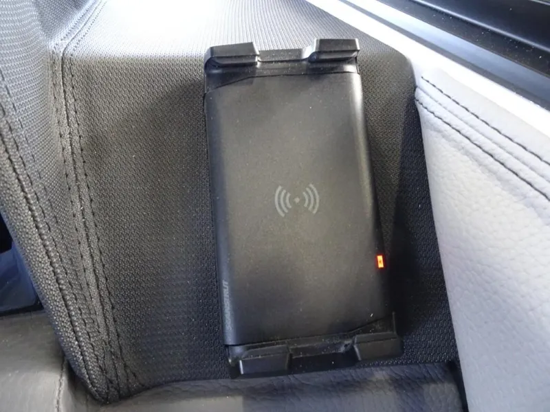 Slide: The Image of Wireless charging pad in a 2025 Cobalt R4 car interior. - 19