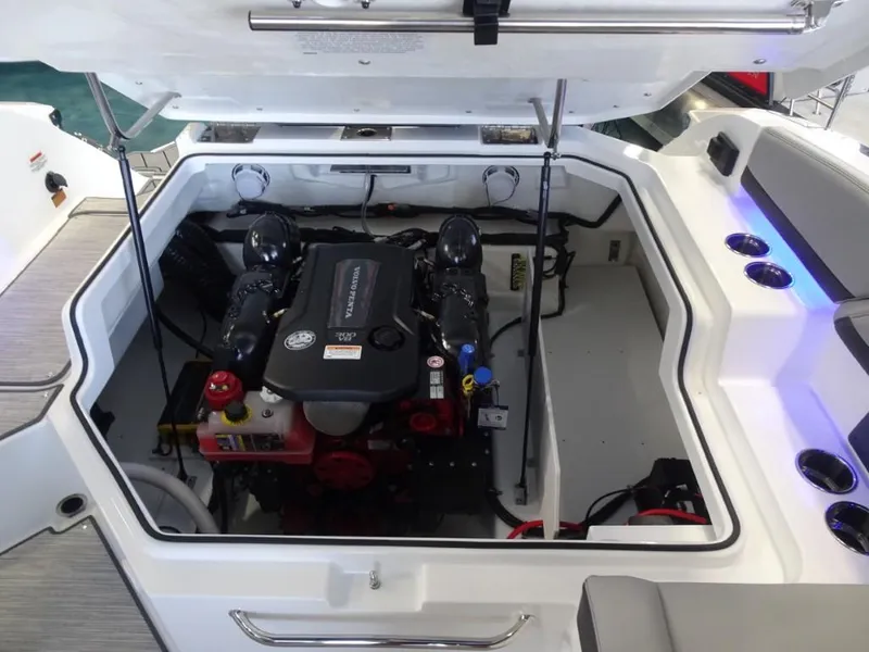 Slide: The Image of 2025 Cobalt R4 boat engine compartment with open hatch, showcasing modern engine design. - 22