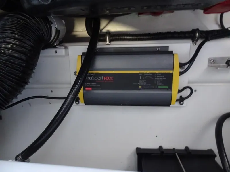 Slide: The Image of Battery charger in a 2025 Cobalt R4 boat engine compartment. - 25