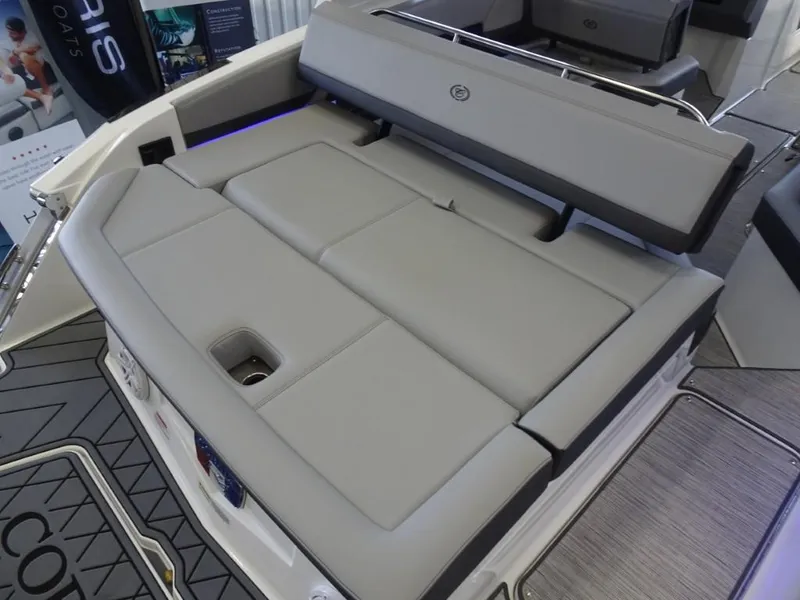 Slide: The Image of 2025 Cobalt R4 boat with spacious, cushioned seating area in light gray upholstery. - 8