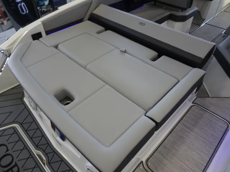 Slide: The Image of 2025 Cobalt R4 boat interior with luxurious gray seating and modern design. - 9