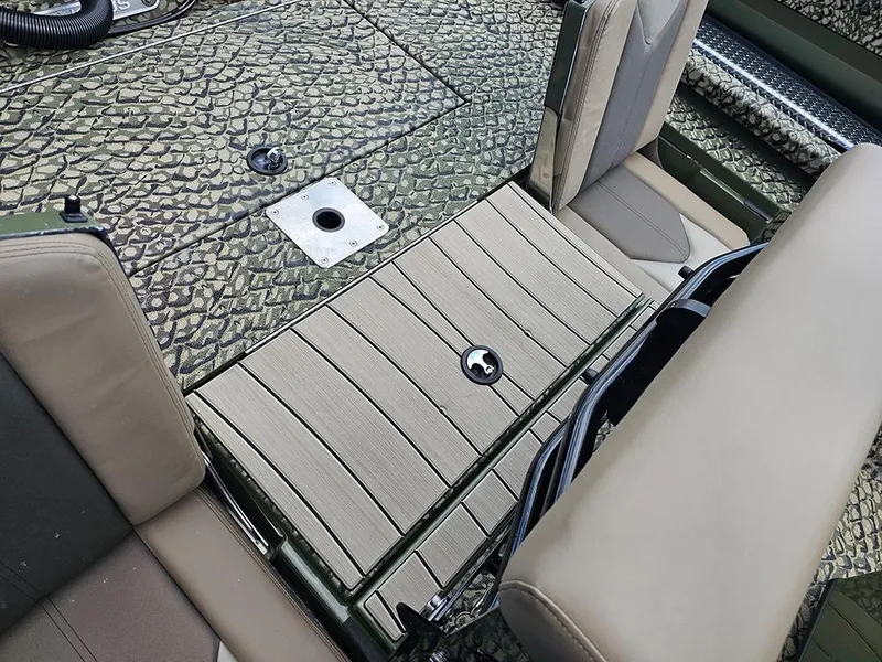 Slide: The Image of 2025 Vexus ACX 2000 boat interior with textured flooring and seating. - 11