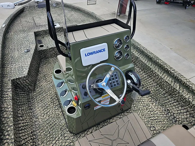 Slide: The Image of 2025 Vexus ACX 2000 boat console with Lowrance electronics and steering wheel. - 13