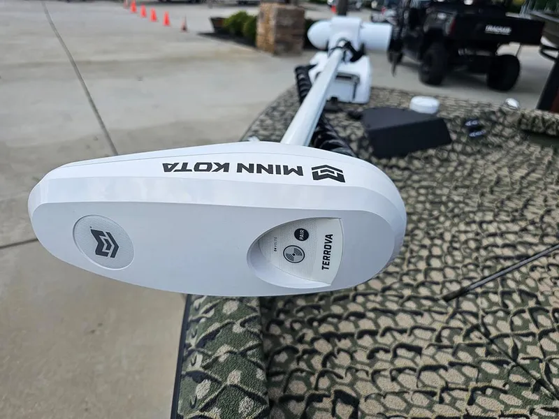 Slide: The Image of Minn Kota Terrova motor on 2025 Vexus ACX 2000 boat, outdoor setting. - 17