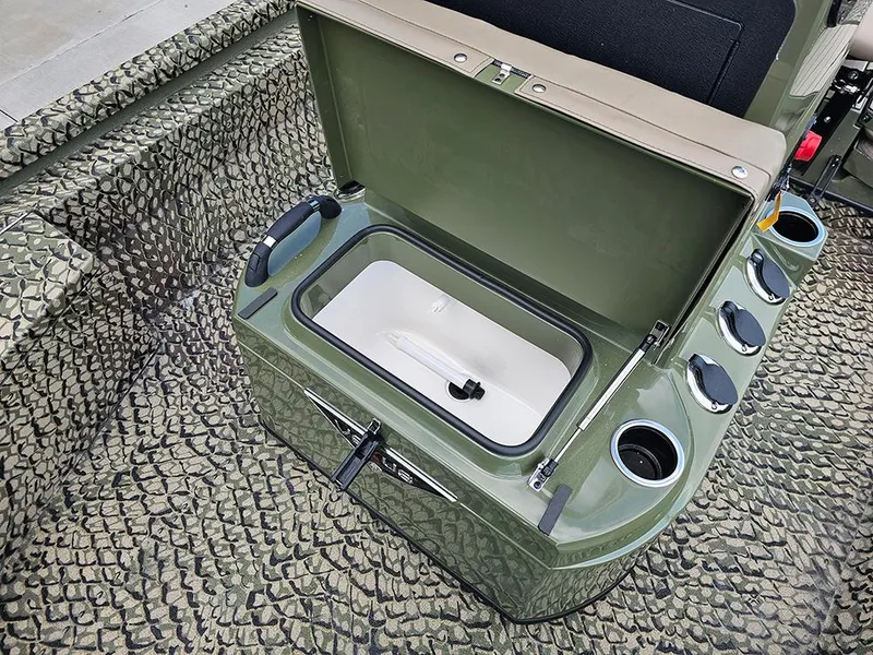 Slide: The Image of Open storage compartment in 2025 Vexus ACX 2000 boat with cup holders and textured flooring. - 20