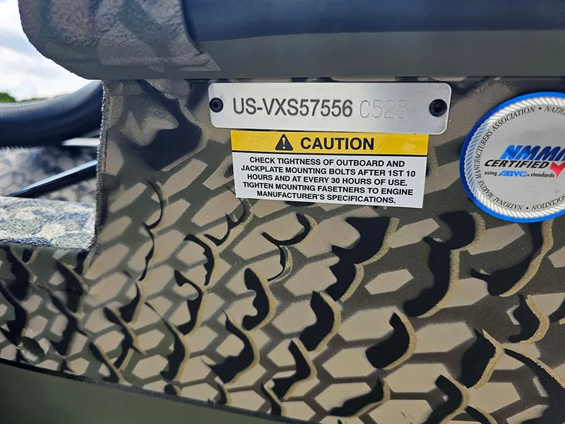 Slide: The Image of 2025 Vexus ACX 2000 boat caution label with camouflage pattern and certification sticker. - 23