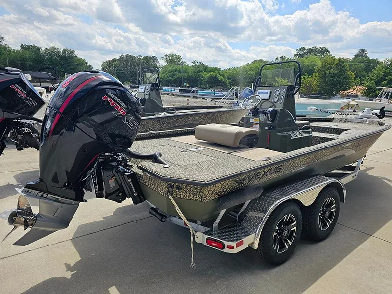 Slide: The Image of 2025 Vexus ACX 2000 boat with powerful outboard motor, parked on a trailer. - 3