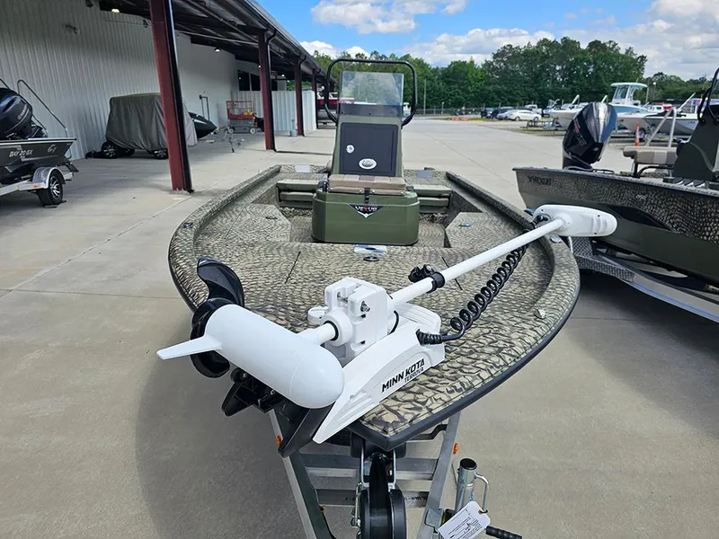 Slide: The Image of 2025 Vexus ACX 2000 boat with camouflage design and Minn Kota trolling motor. - 4