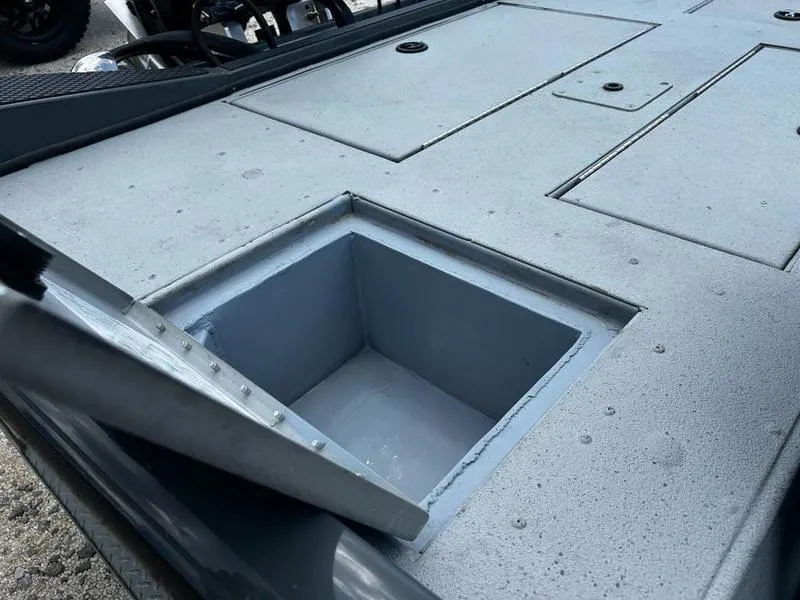 Slide: The Image of Open storage compartment on 2019 Triton 18 TX boat deck. - 15
