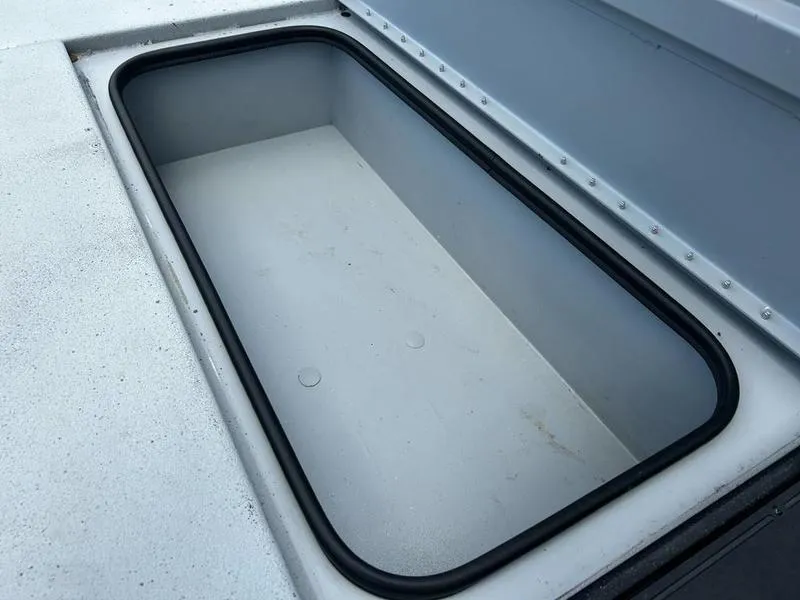 Slide: The Image of Storage compartment of 2019 Triton 18 TX boat, featuring a spacious interior. - 22
