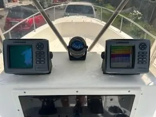 Slide: The Image of 2001 Sea Hunt Triton 200 boat dashboard with Lowrance navigation displays. - 5