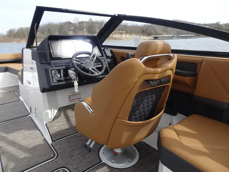 Slide: The Image of 2025 Cobalt R8 boat interior with tan leather seats and modern dashboard. - 11