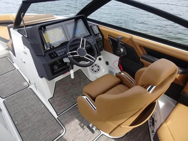 Slide: The Image of Luxurious 2025 Cobalt R8 boat cockpit with tan leather seats and advanced navigation system. - 12