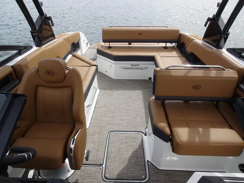Slide: The Image of 2025 Cobalt R8 boat interior with tan leather seating and spacious layout. - 18