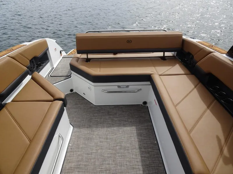Slide: The Image of Luxurious seating on 2025 Cobalt R8 boat, overlooking calm water. - 19