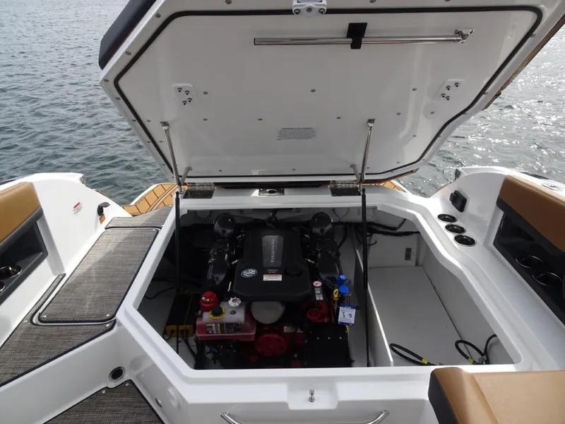 Slide: The Image of 2025 Cobalt R8 boat engine compartment open on water. - 20