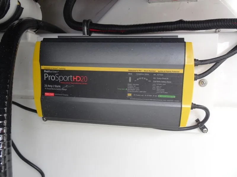 Slide: The Image of Battery charger in a 2025 Cobalt R8, ProMariner ProSportHD20 model, mounted on a white surface. - 23