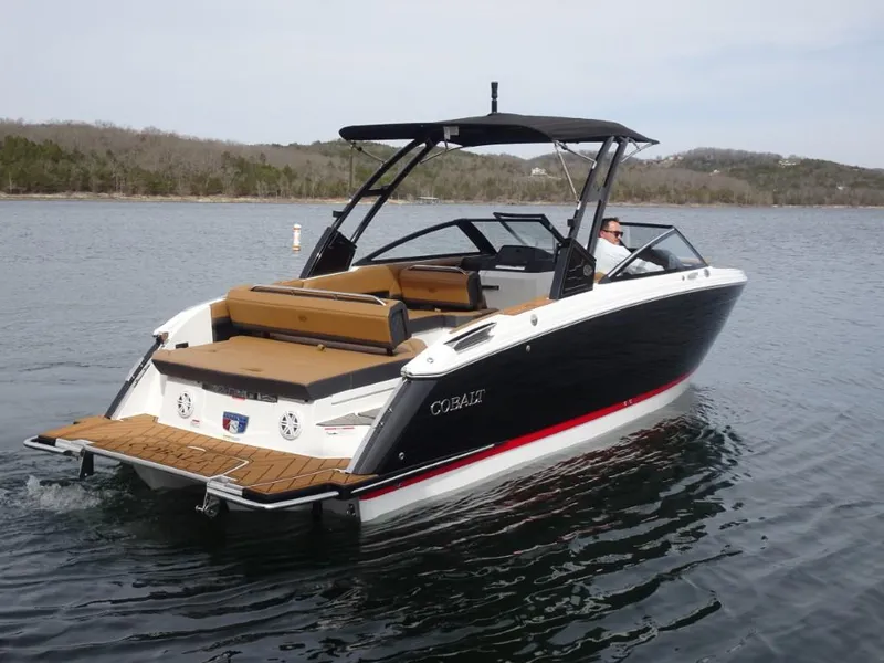 Slide: The Image of 2025 Cobalt R8 boat on a calm lake, featuring sleek design and spacious seating. - 3