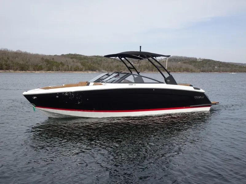 Slide: The Image of 2025 Cobalt R8 boat on calm water with scenic background. - 5