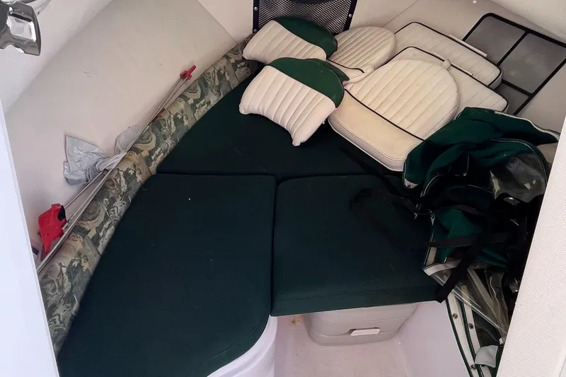 Slide: The Image of 2001 Pro-Line 20 WALK cabin interior with green and white cushions. - 16