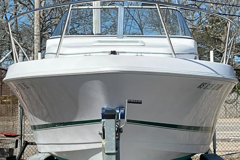 Slide: The Image of 2001 Pro-Line 20 WALK boat on trailer, front view, outdoors. - 2