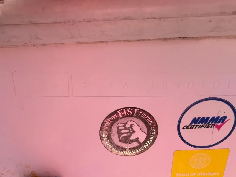 Slide: The Image of 2001 Pro-Line 20 WALK boat with FIST technology and NMMA certification stickers. - 22