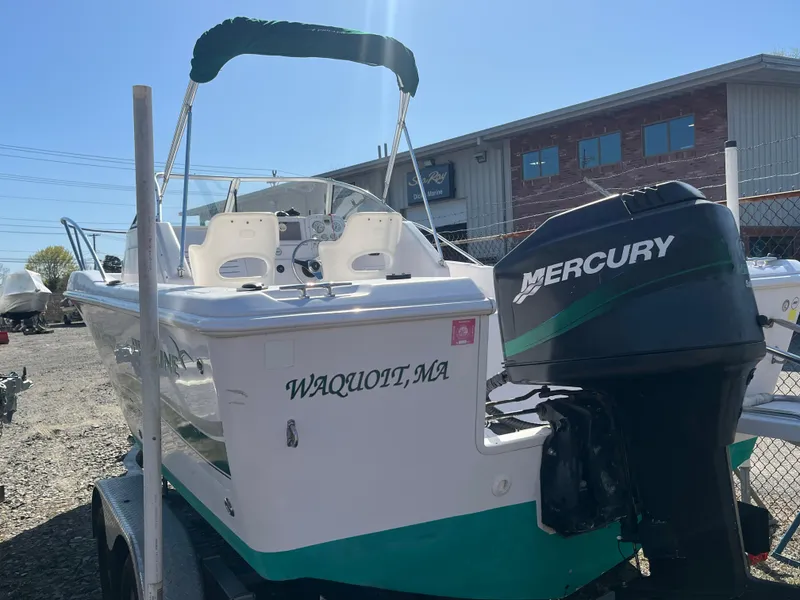 Slide: The Image of 2001 Pro-Line 20 WALK boat with Mercury outboard motor, parked on a trailer. - 4