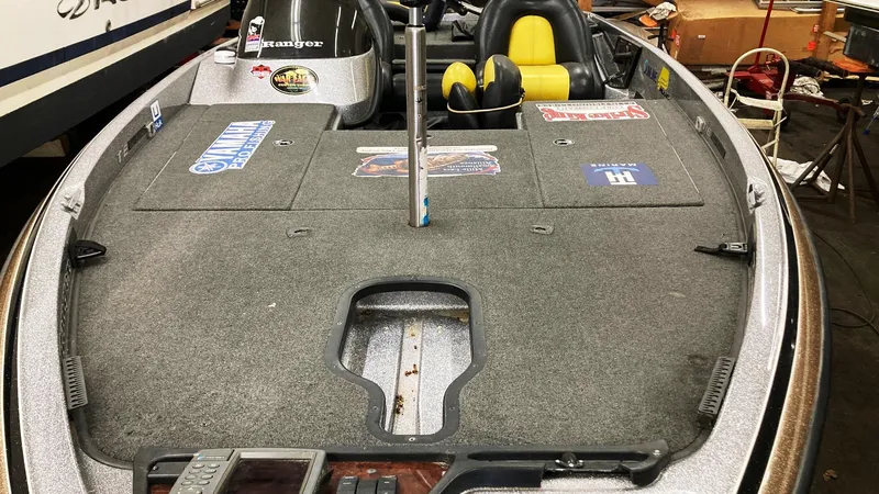 Slide: The Image of 2007 Ranger 519 VX boat with Yamaha engine, featuring spacious seating and dashboard controls. - 2