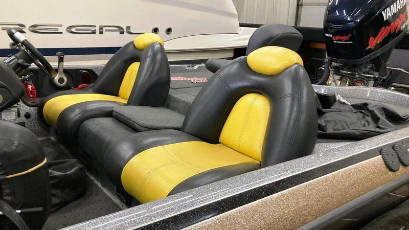 Slide: The Image of 2007 Ranger 519 VX boat interior with yellow and black seats. - 3