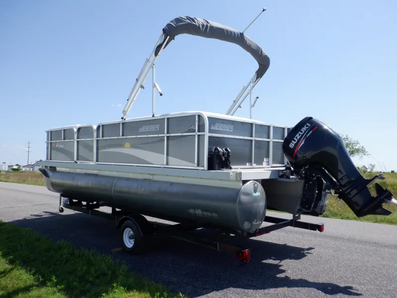Slide: The Image of 2014 Weeres Cadet Cruise 200 pontoon boat on trailer with Suzuki outboard motor. - 13