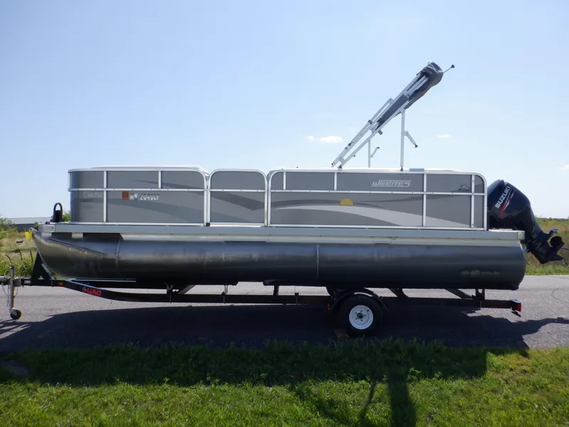 Slide: The Image of 2014 Weeres Cadet Cruise 200 pontoon boat on trailer, side view. - 14