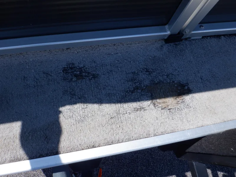 Slide: The Image of Worn carpet on 2014 Weeres Cadet Cruise 200 pontoon boat deck. - 15